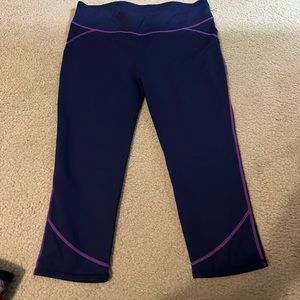 Navy fabletics capri leggings with purple trim. XL